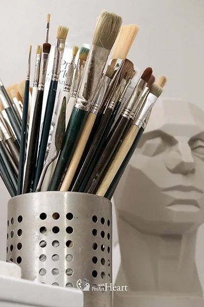 Oil brushes in a jar